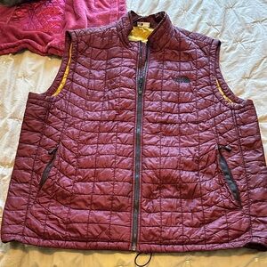 The North Face size XL Burgundy Quilted Vest with Yellow Lining